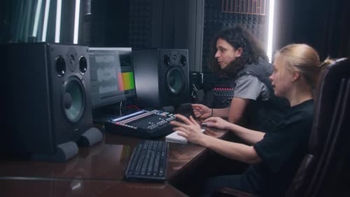 Female Audio Engineer and Singer Create Song in Recording Studio