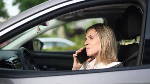 Businesswoman Talking on Phone While Driving