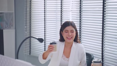 Young attractive businesswoman and businessman work in office workplace.