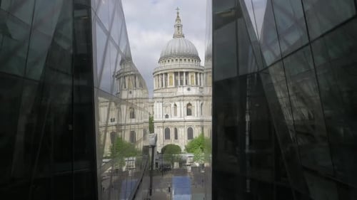 Beautiful wide shot of St Paul's Cathedral in London from within upward moving lift opposite.
