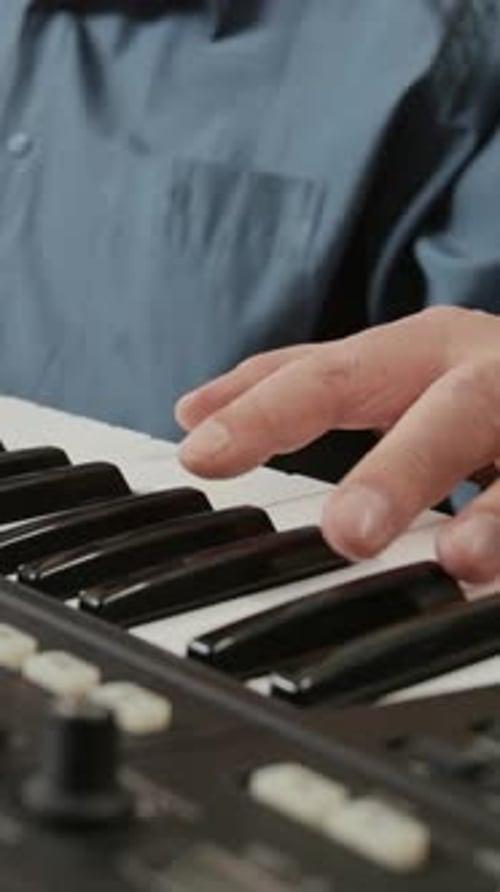 Closeup of Teacher Showing Melody to Black Man Vertical
