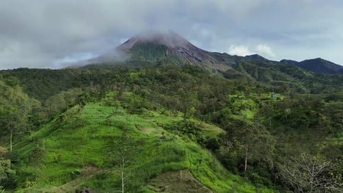 Majestic Merapi Volcano Peaks with Early Morning Clouds