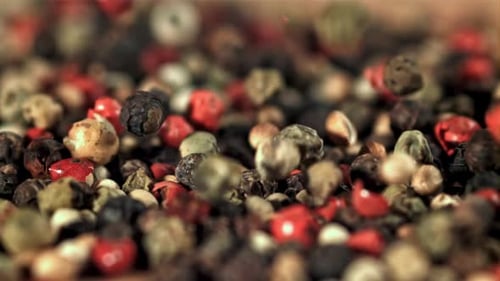 Peppercorn Falls Into a Pile of Grains Filmed on a Highspeed Camera at 1000 Fps