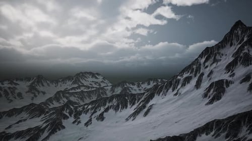 Panoramic Aerial View of Snow-Covered Mountain Range