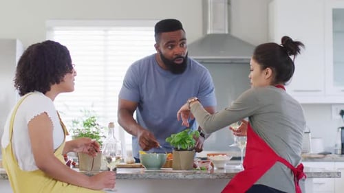 Friends Cooking Together in a Modern Kitchen