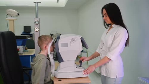 Female Optometrist Examining Child's Vision Health