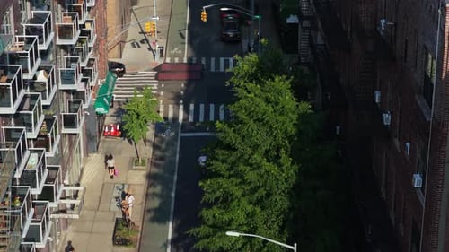 Aerial View of Manhattan's Urban Landscape Featuring Iconic Yellow Taxis Graffiti Art and Cycle Lane