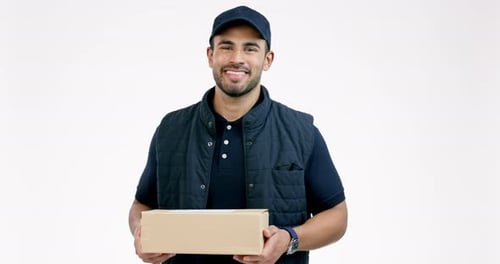 Happy man, box and delivery in logistics, supply chain or ecommerce against a grey studio