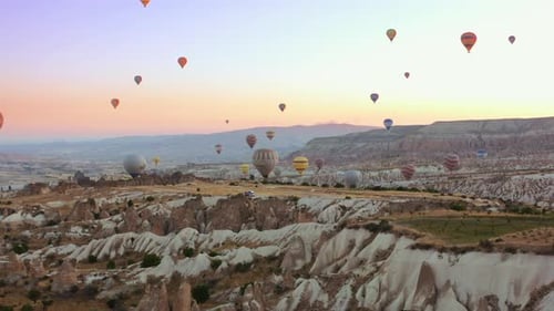 Aerial view of hot air balloon flying over Cappadocia at summer sunrise. Turkey. 4K. Famous air to