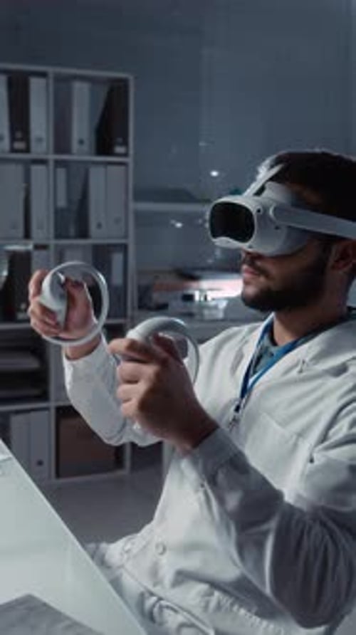 Male Student Performing Scientific Experiment in Virtual Reality Headset