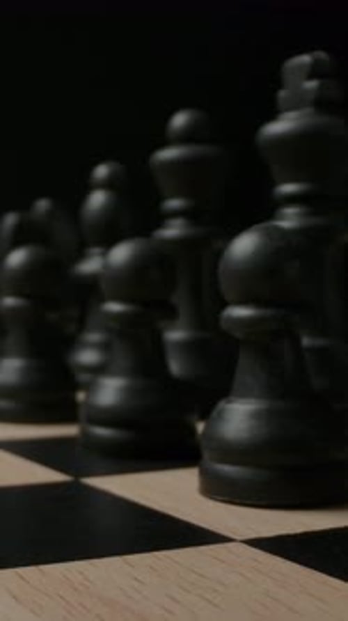 Chess Pieces Positioned on a Board Close Up
