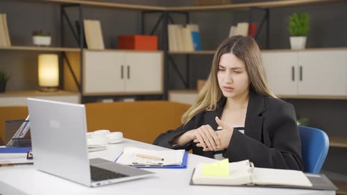 Businesswoman having heart attack.