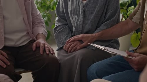Group of Older Adults Clapping Hands in Meeting