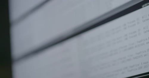 Close-up of a computer screen displaying code with a panning camera movement