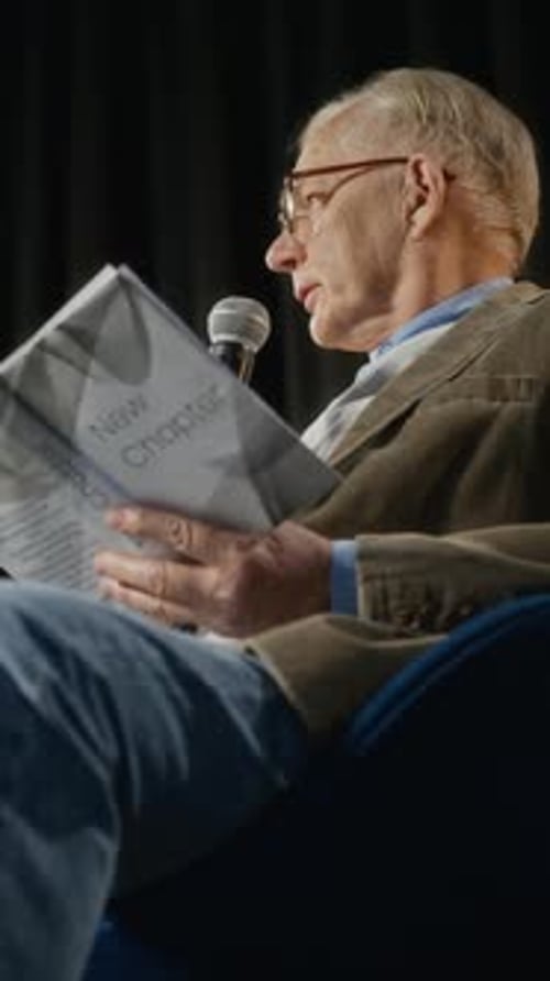 Senior Man Speaking at Book Presentation Press Conference