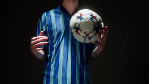 Professional Football Player Throwing Ball Closeup Sportsman Portrait Training Soccer in Studio