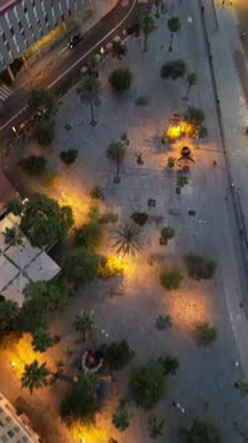 Aerial video on Barcelona's coastline people doing a sap.