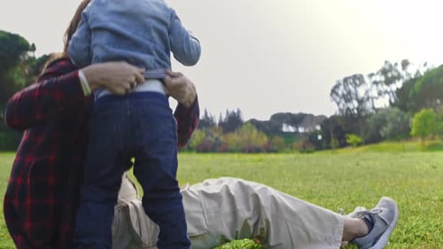 Lovely Mother with Little Son in the Park