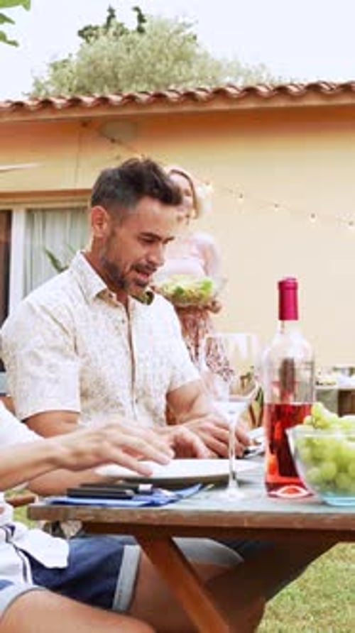 Friends Celebrate Birthday Together in Outdoor Garden