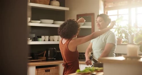 Affectionate Couple Embracing in Sunny Kitchen