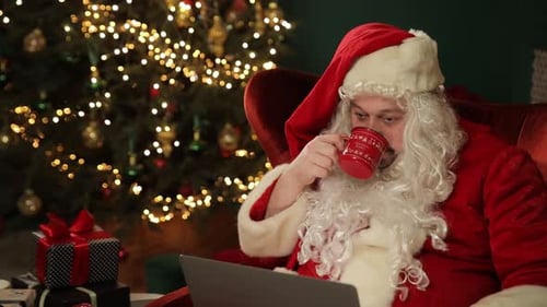 Santa Claus Resting and Drinking Hot Beverage