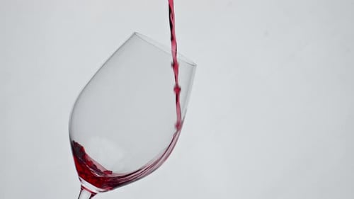Red Wine Being Poured Into a Wine Glass