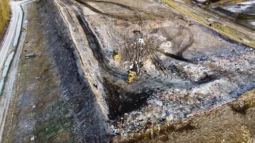Aerial flyover landfill full of trash, pollution environmental problem, garbage, trucks dump waste p