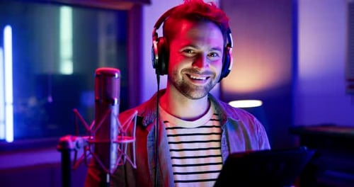 Man, musician and headphones with tablet in recording studio for music production