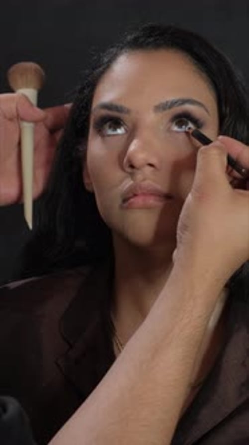 Glamorous Woman Having Makeup Applied to Eyes