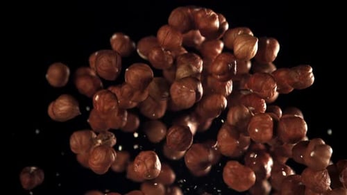 Hazelnuts Floating Upward in Slow Motion