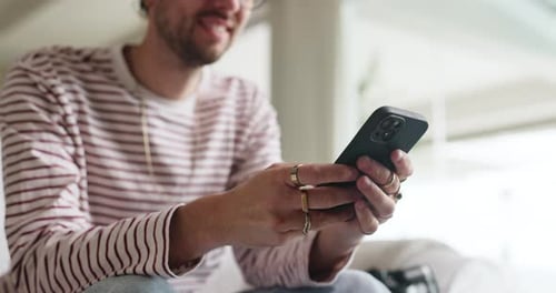Hands, typing and man with smartphone, lounge and communication with contact
