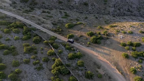 Campervan driving on a small road in Croatia during sunset