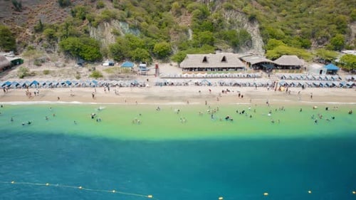 Aerial view of Active Beach, Speedboats, and Touristic Towers – Playa Blanca, Santa Marta