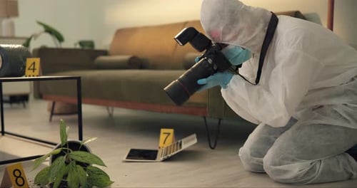 Forensic Investigator Taking Photos at a Crime Scene