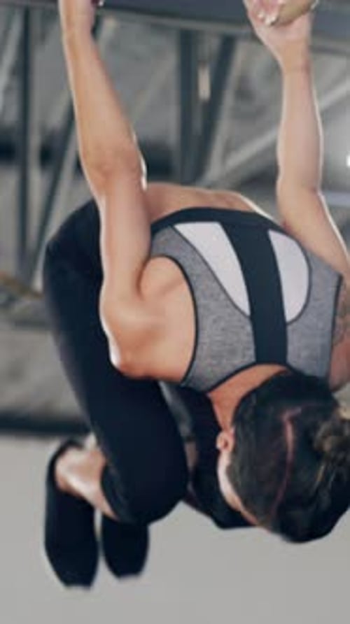 Gymnastic rings, workout and fitness with woman in gym for calisthenics athlete, health and muscle