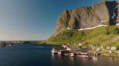 Majestic Coastal Village Nestled By Towering Cliffs in Norway