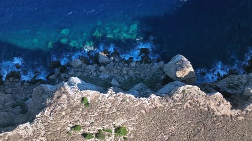 Aerial View of Turquoise Sea Meets Rugged Coastline