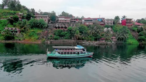 A Ferry crusing on the majestic waters of Lake Toba, Sumatra.