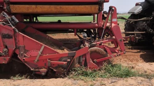 Modern Industrial Harvester Working Hard To Harvest Crops In The Field
