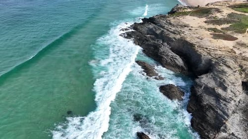 Aerial 4K View of rugged cliffs and beach along the Alentejo Coast, Portugal