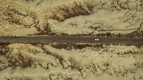 Aerial view of a vehicle crossing the Abanilla desert or Mahoya desert in Murcia