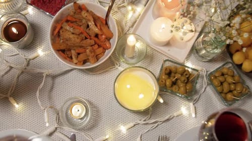 Friends Toasting Wine Glasses Around Table With Food