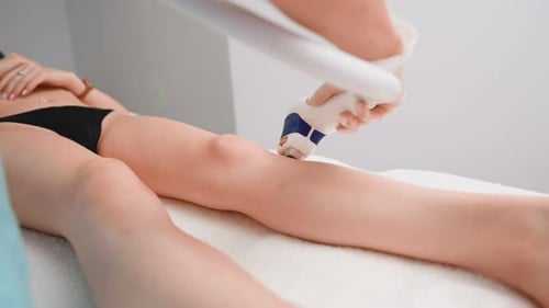 Woman Beautician Makes Procedure for Laser Hair Removal Beautiful Female Patient