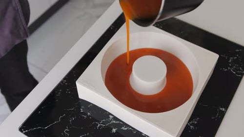Caramel Being Poured into a Baking Mold