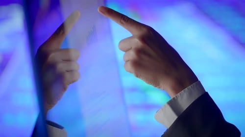 Hands Interacting with Data Charts on Transparent Screen