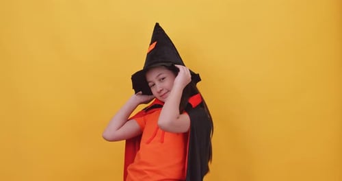 Child Poses in Witch Costume
