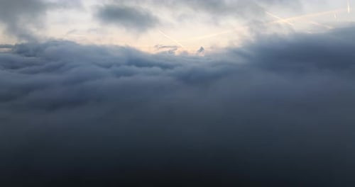 Aerial View Over the Clouds at Sunrise