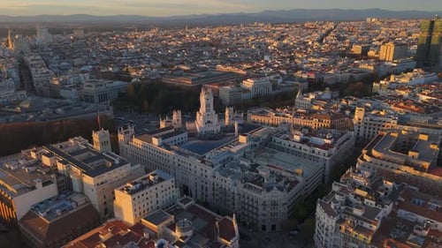 A Breathtaking Aerial View of a Vibrant Urban Cityscape Captured Beautifully During Sunset