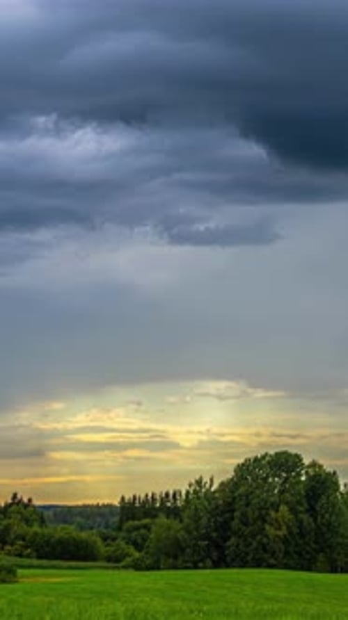 Vertical View Of Dark Cloudy Sky Over Countryside Landscape. Timelapse