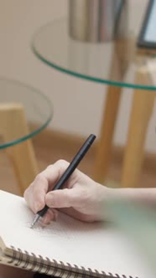 Hand Drawing in Notebook Close Up